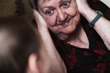 woman covering her ears photo